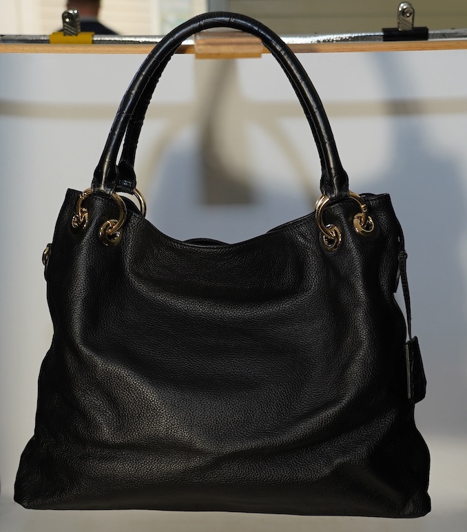 A black leather Prada handbag